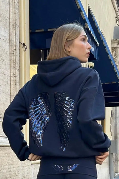 Ensemble sweat-shirt à capuche Free Wing pour femme, haut uni et pantalon long, collection 2026, style streetwear décontracté et unique.